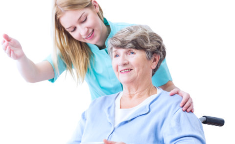 a caregiver woman pointing with an elderly woman