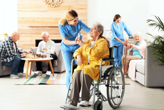 smiling nurse and woman on wheelchair